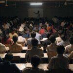 Students filling a crowded entrance-exam coaching classroom in India